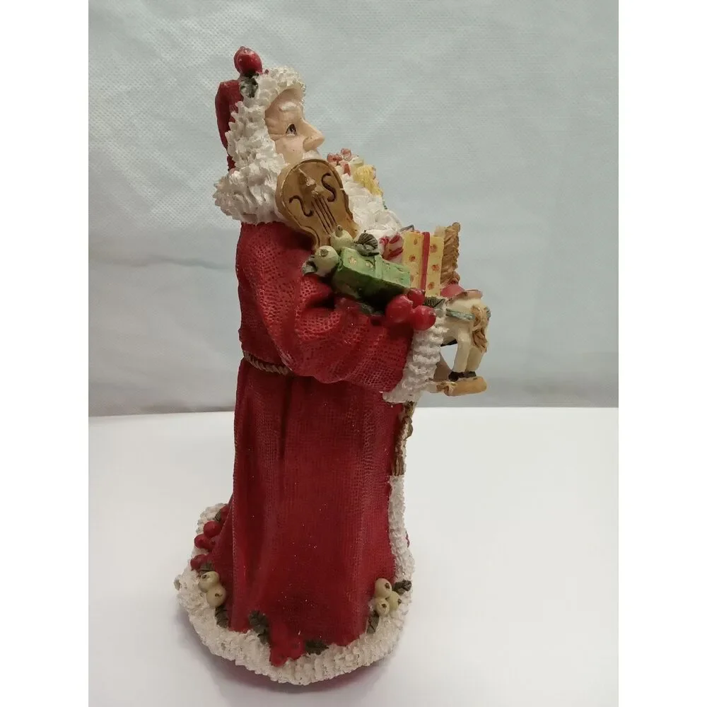 Santa Figurine  ceramic‎ holding gifts appox 9x5x5